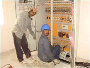 Technician from IISC, installing the system´s control panel.  